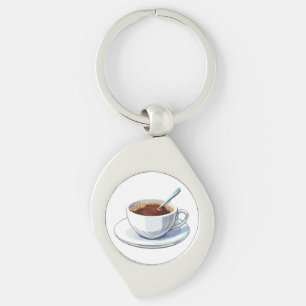 Witte koffiekop op een schoteltje gevuld met koffi sleutelhanger