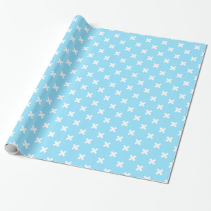 Witte kruisstiften op babyblauw cadeaupapier