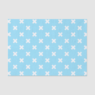 Witte kruisstiften op babyblauw tissuepapier