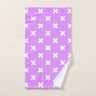Witte kruisstiften op lila handdoek