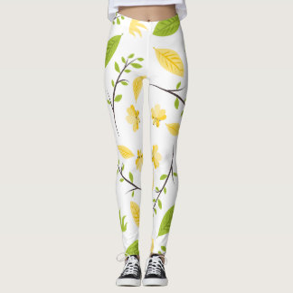 Witte legging met groene bladeren en gele bloem