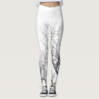 Witte leggings met boomtakken.