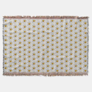 Witte madeliefjes op een plaid deken