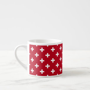 Witte polka kruist op rood espresso kop