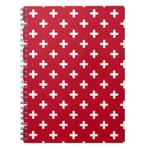 Witte polka kruist op rood notitieboek