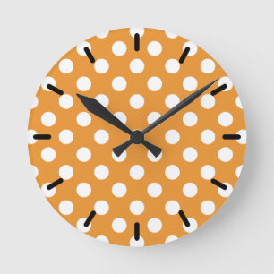 Witte polka-stippen op amber ronde klok
