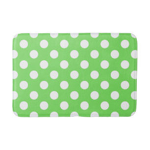 Witte polka stippen op appelgroen badmat