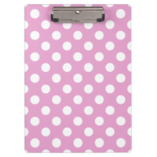 Witte polka stippen op bleek roze klembord