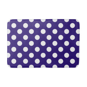 Witte polka stippen op donkerblauw badmat