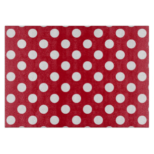 Witte polka stippen op rood snijplank