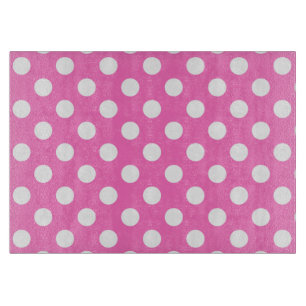 Witte polka stippen op roze snijplank