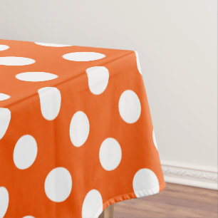 Witte polka stippen op sinaasappel tafelkleed