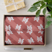 Witte schedel en kruisbeenderen op rode strepen tissuepapier (Geschenk)