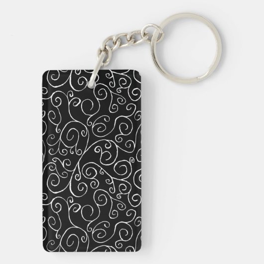 Witte scrollende curven op zwart sleutelhanger (achterkant)