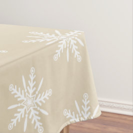 Witte sneeuwvlokken op beige Xmas tablecloth. Tafelkleed