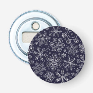 Witte sneeuwvlokken op blauw button flesopener
