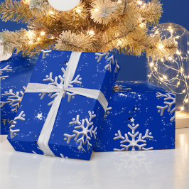 Witte sneeuwvlokken op blauw kerstfeest cadeaupapier