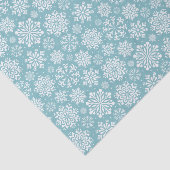 Witte sneeuwvlokken op blauw kerstfeest tissuepapier (Detail)