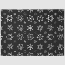 Witte sneeuwvlokken op zwarte kerst tissuepapier