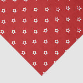 Witte sterren op helder rood tissuepapier (Detail)