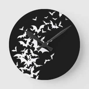 Witte vlekken op zwart ronde klok