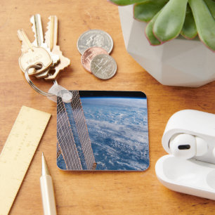 Wolk-bedekte Tasman en koraal Zeeen. Sleutelhanger