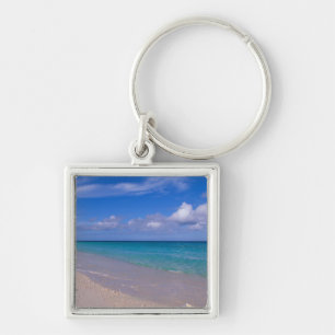 Wolk in de blauwe lucht boven zandig strand sleutelhanger