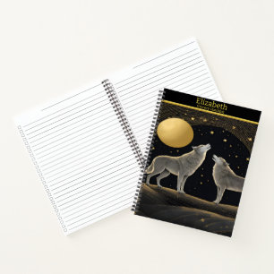 Wolven huilen sereen naar een stralende gouden maa notitieboek