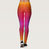 Woman in rainbow gradient leggings with a subtle  (Dos)