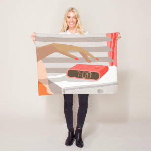 Womans hand pushing on alarm clock snooze button fleece deken