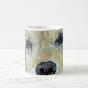 Yeux de golden retriever et tasse d'art de nez