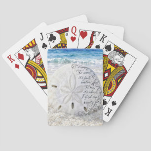 Zanddollar met inspirerende quote pokerkaarten