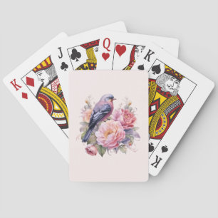 Zangvogel staande bovenop roze pioenrozen pokerkaarten