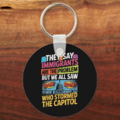 Ze zeggen dat immigranten het probleem zijn, maar  sleutelhanger (Voorkant)