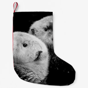 Zee otters: zwart wit paar. kleine kerstsok