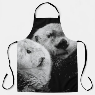 Zee otters: zwart wit paar. schort