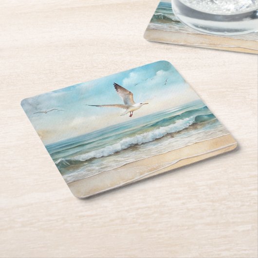 Zeemeeuwen die op een strand vliegen vierkante kartonnen onderzetter (Schuin)