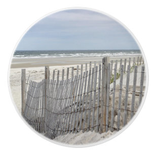 Zeestrand en ingeweven omheining keramische knop