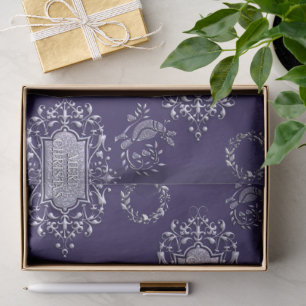 Zilveren kerstdecoratie op blauw kerstfeest tissuepapier