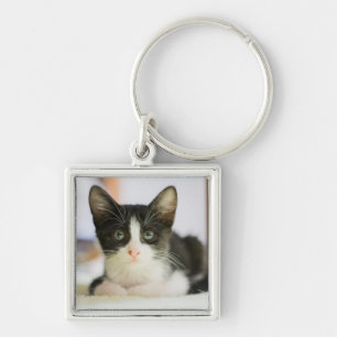 Zoete witte en zwarte keuken sleutelhanger