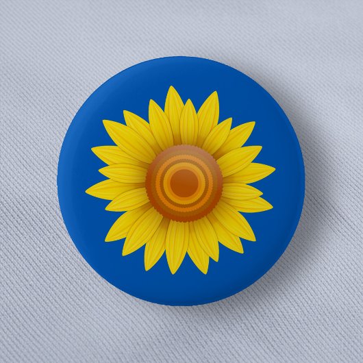 Zonnebloem op blauw ronde button 5,7 cm
