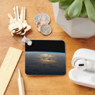 Zonnige stralen van een deels bewolkt zuiden van d sleutelhanger