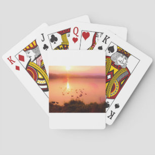 Zonset van roze en perzikmeer pokerkaarten