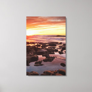 Zonsondergang boven getijdenpoelen canvas afdruk
