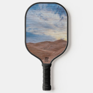 Zonsondergang over zandduinen op houtnerf foto pickleball paddle
