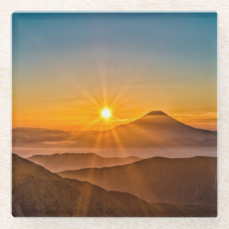 Zonsopkomst tussen de heuvels glazen onderzetter