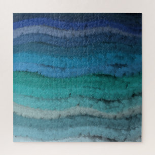 Zoutgolven voor kuststrand op zwart legpuzzel