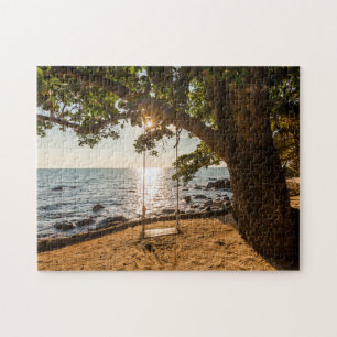 Zwaaien op de strand bij zonsondergang legpuzzel