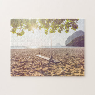 Zwaaien op de strand bij zonsondergang legpuzzel