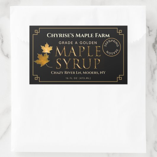 Zwart apeletiket met etiket op spuit met lek en da (Tas)